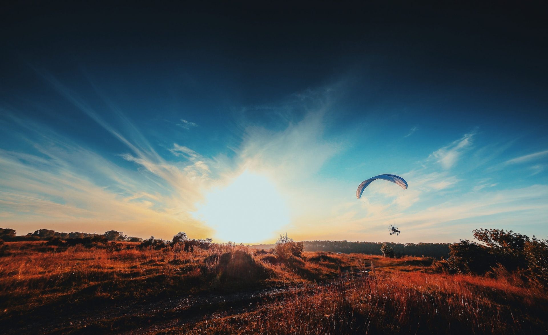 Beautiful sunset and paraglider
